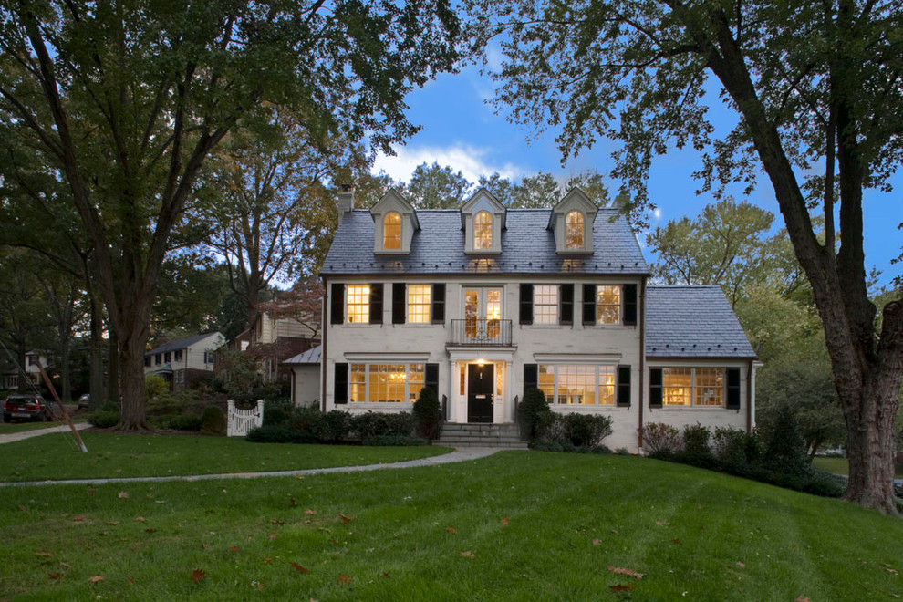 Large traditional white three-story brick house exterior idea in DC Metro with a shingle roof