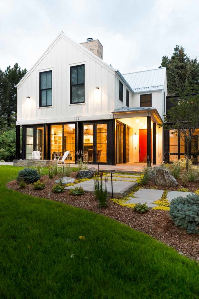 Trendy house exterior photo in Denver with a metal roof