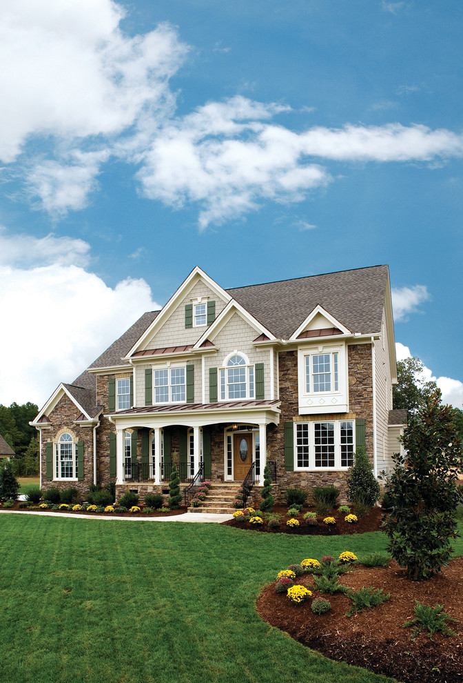 Design ideas for a traditional house exterior in Atlanta with stone cladding.