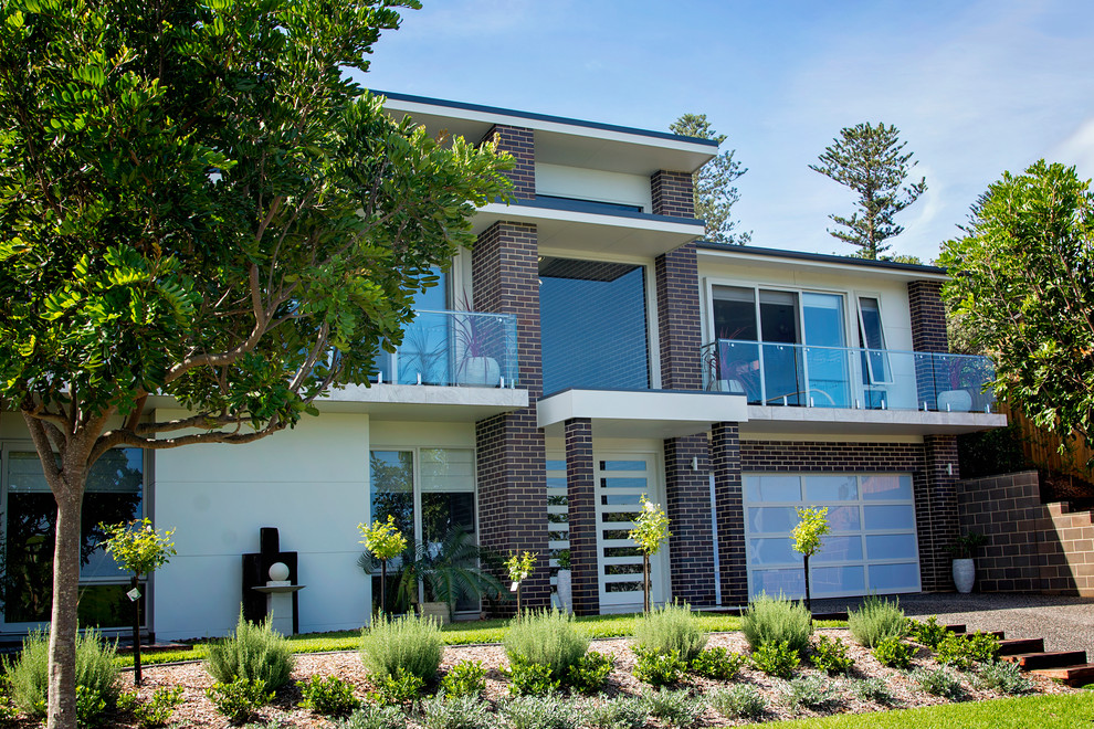 Inspiration for a large timeless multicolored two-story brick exterior home remodel in Wollongong