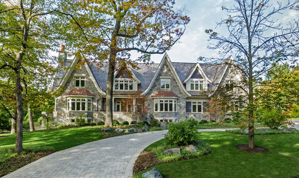Huge elegant gray two-story stone gable roof photo in Milwaukee