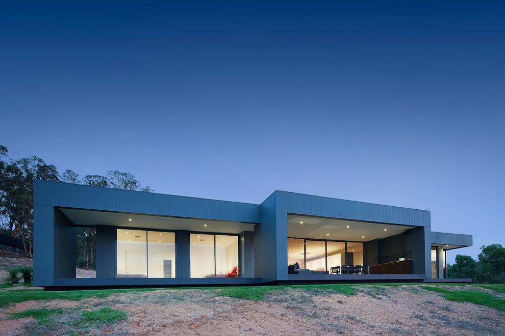 Inspiration for a contemporary gray one-story concrete fiberboard flat roof remodel in Perth