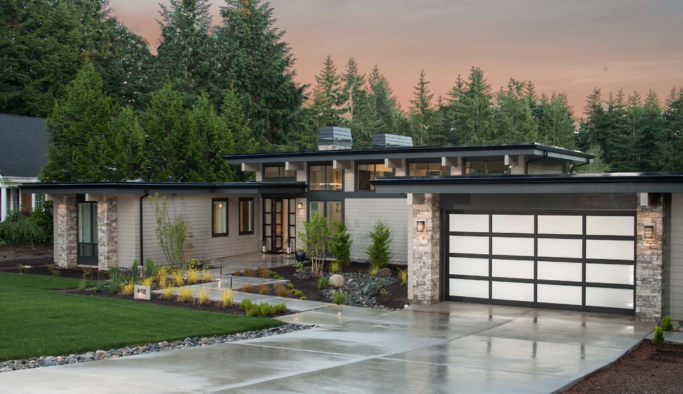 Mid-sized contemporary gray one-story concrete fiberboard exterior home idea in Seattle with a mixed material roof