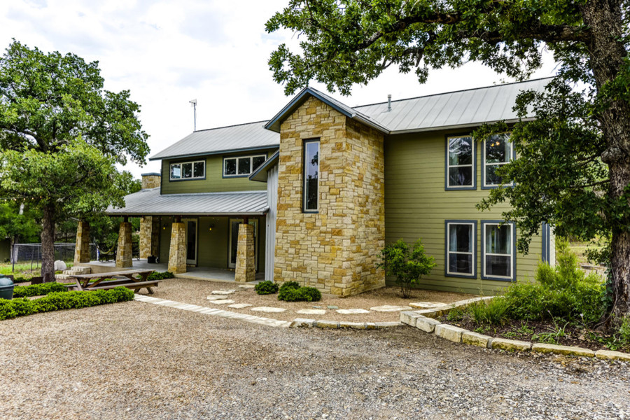 Example of a farmhouse exterior home design in Austin