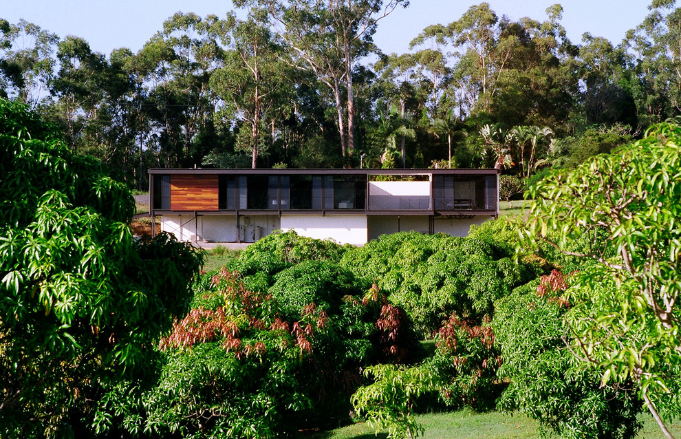Example of a mid-sized minimalist white two-story mixed siding flat roof design in Sunshine Coast