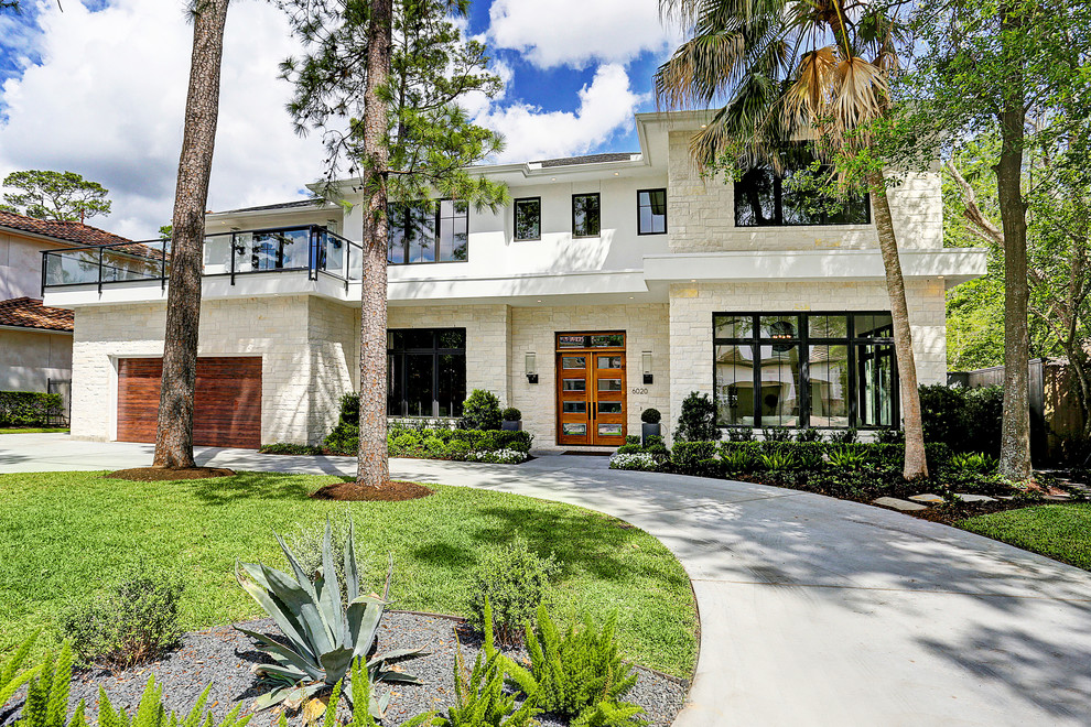 Large trendy beige two-story mixed siding house exterior photo