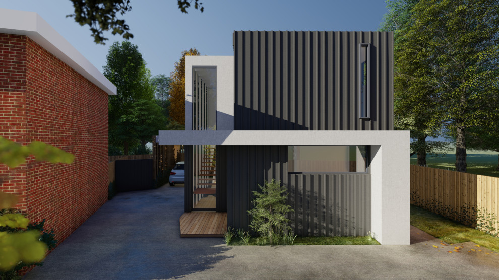 Design ideas for a medium sized and black modern two floor detached house in Melbourne with metal cladding.