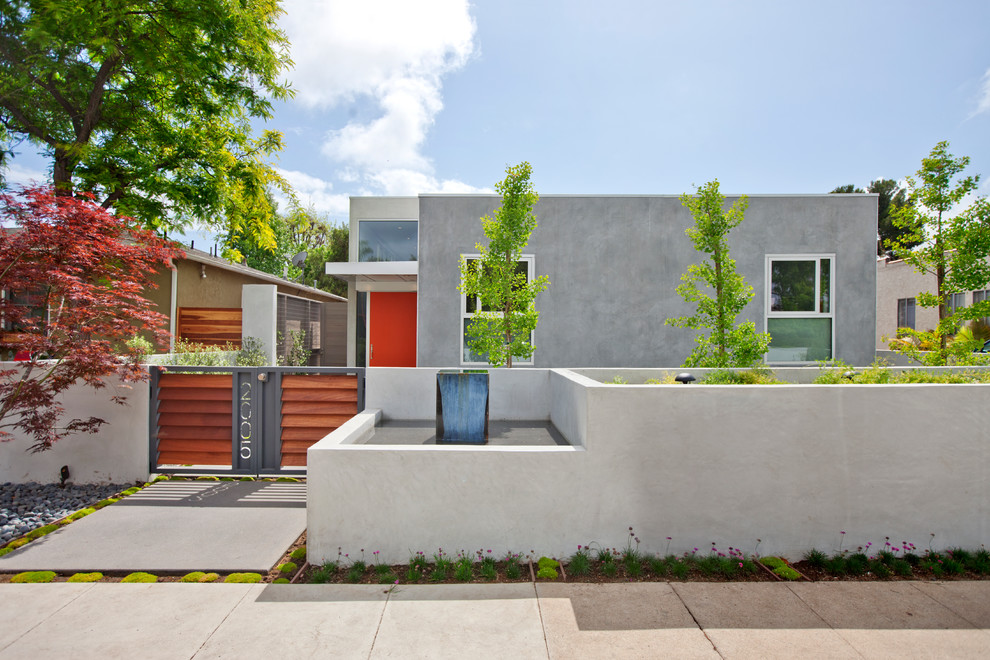Design ideas for a contemporary concrete house exterior in Los Angeles.