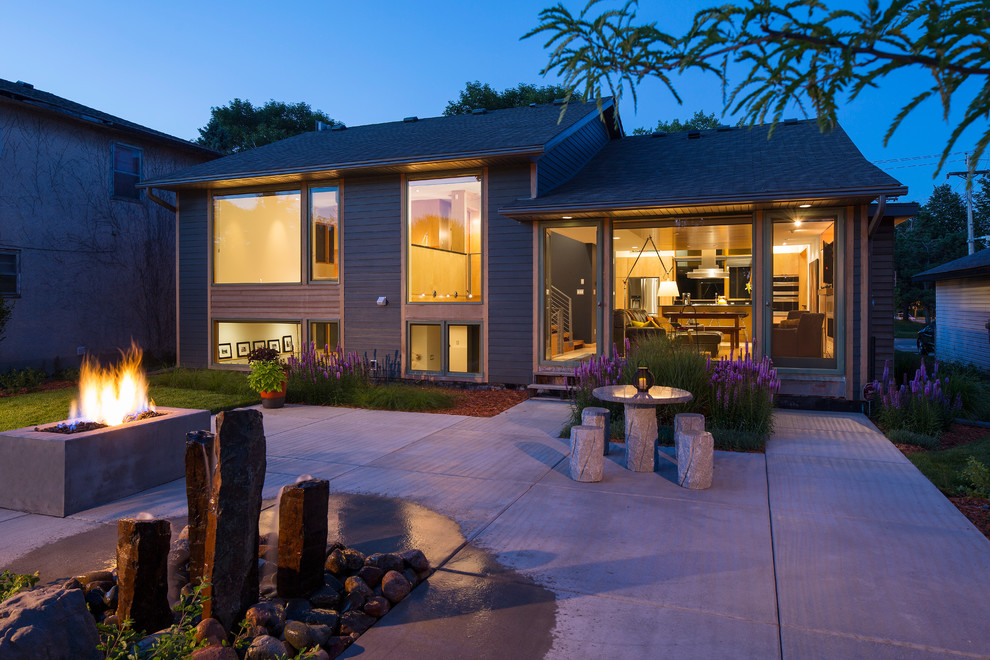 Inspiration for a contemporary gray split-level concrete fiberboard gable roof remodel in Minneapolis