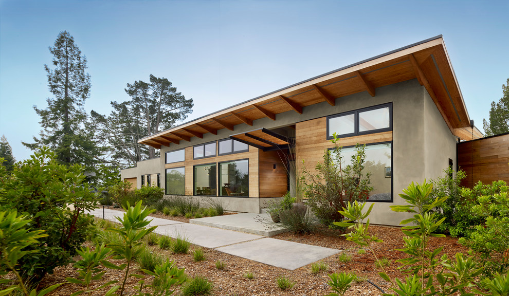 Inspiration for a gey contemporary house exterior in San Francisco with wood cladding.