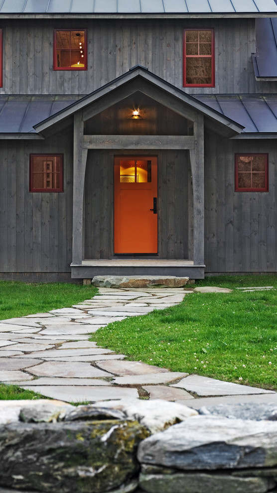 Example of a mountain style two-story wood exterior home design in Burlington