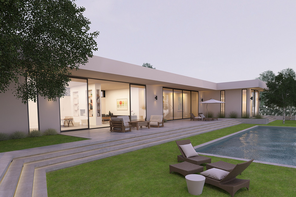 Стильный дизайн: большой, одноэтажный, белый дом в стиле модернизм с облицовкой из цементной штукатурки - последний тренд
