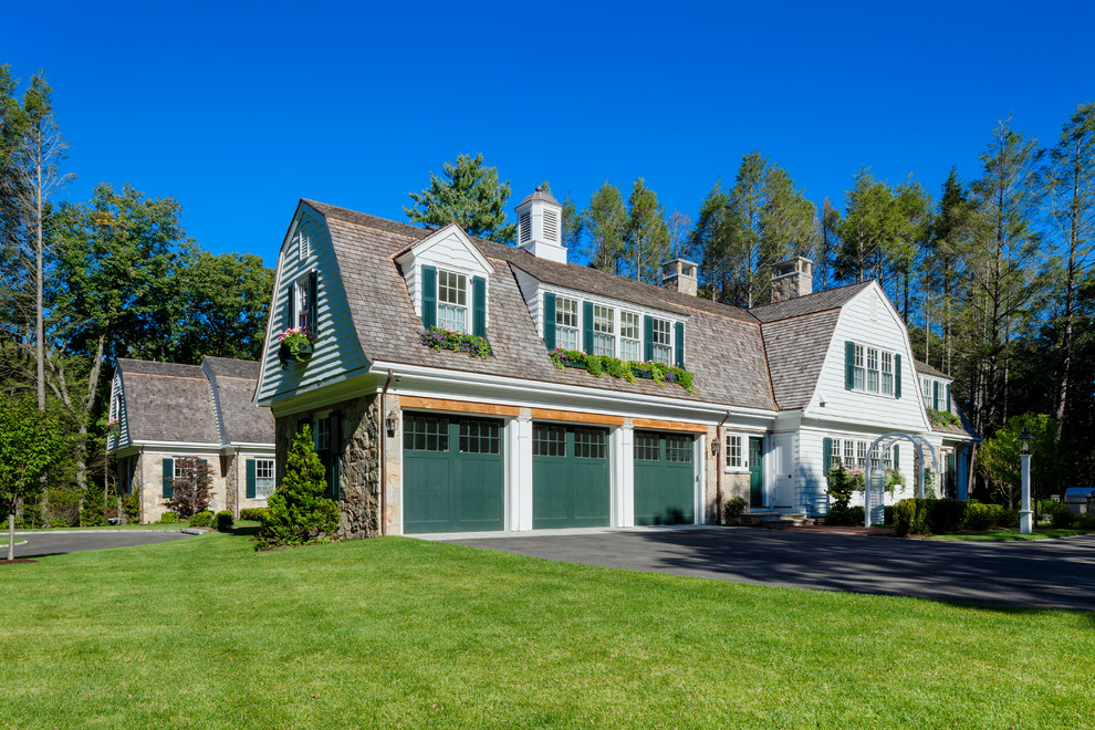 Inspiration for a large timeless white two-story wood exterior home remodel in Boston with a gambrel roof