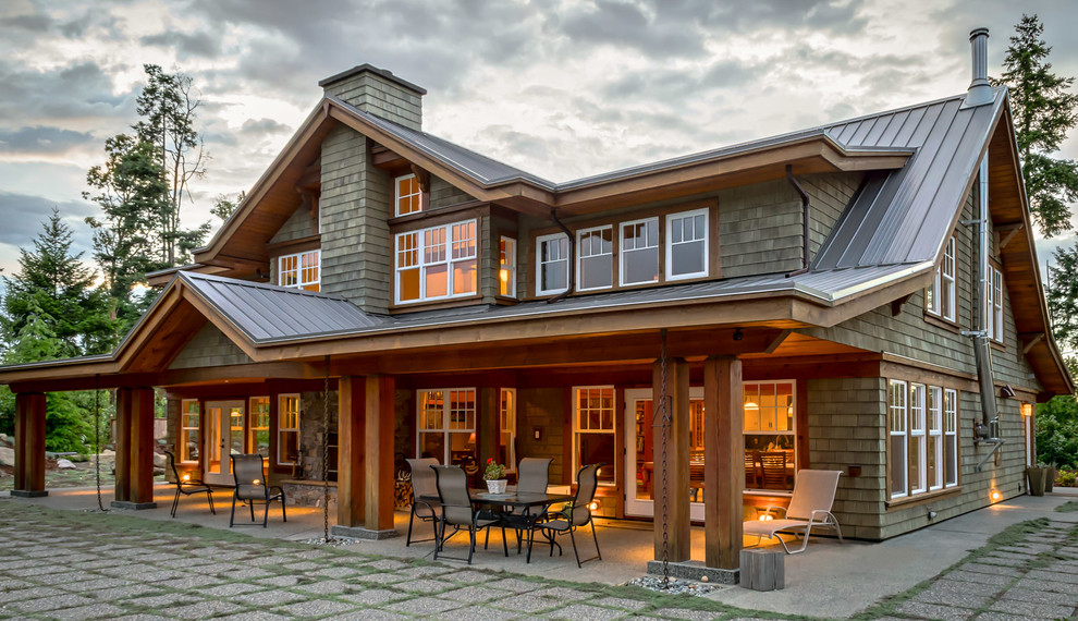 Inspiration for a mid-sized timeless two-story wood gable roof remodel in Vancouver