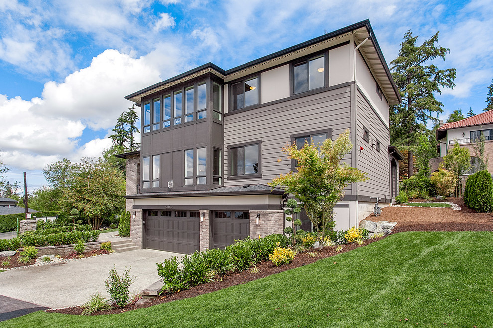 Inspiration for a large transitional beige three-story mixed siding exterior home remodel in Seattle