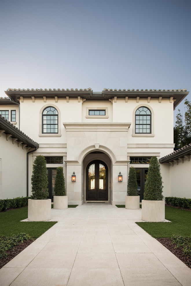 Photo of a mediterranean house exterior in Orlando with a black roof.