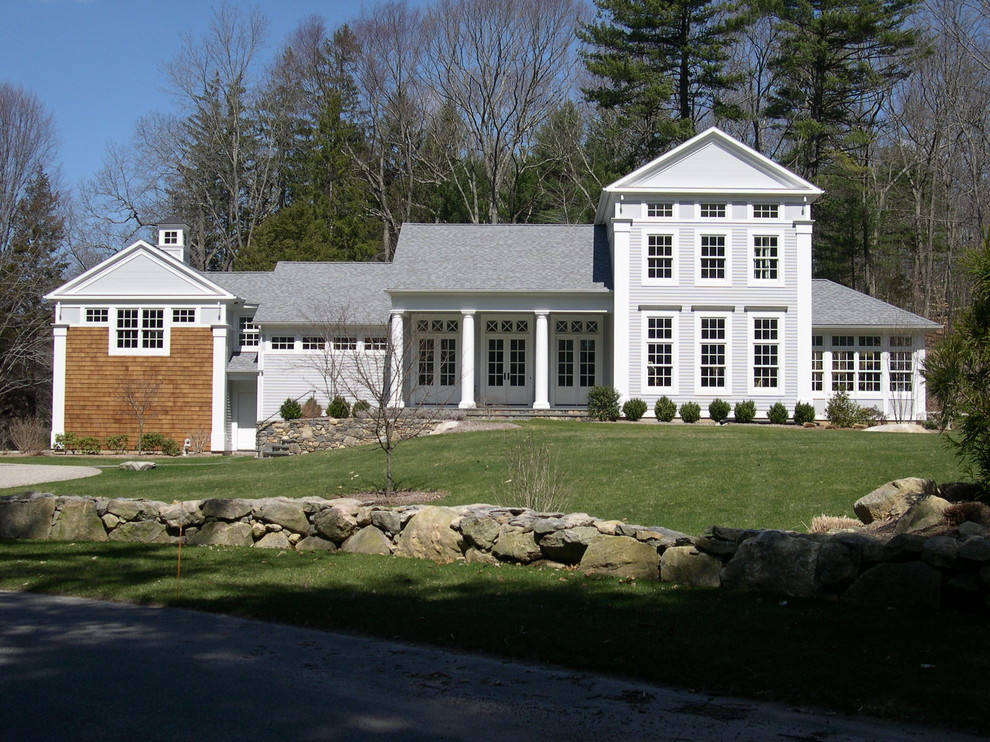 Inspiration for a large timeless gray two-story wood exterior home remodel in Bridgeport