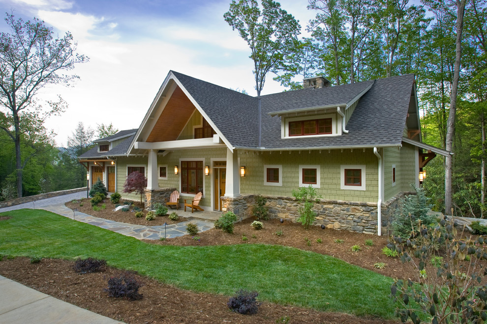 Example of an arts and crafts green exterior home design in Other