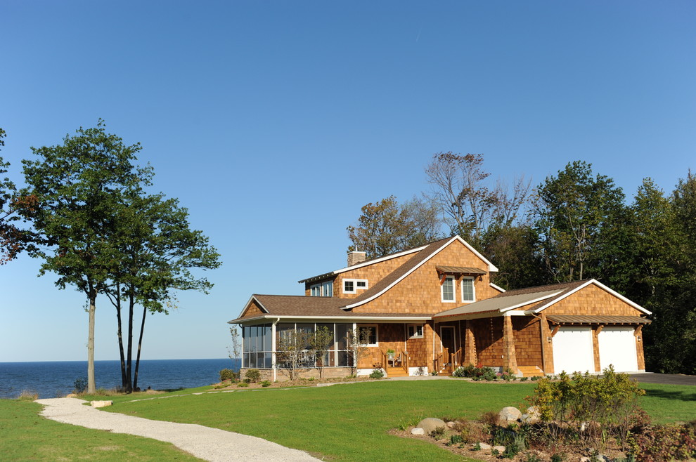Inspiration for a timeless wood exterior home remodel in Grand Rapids