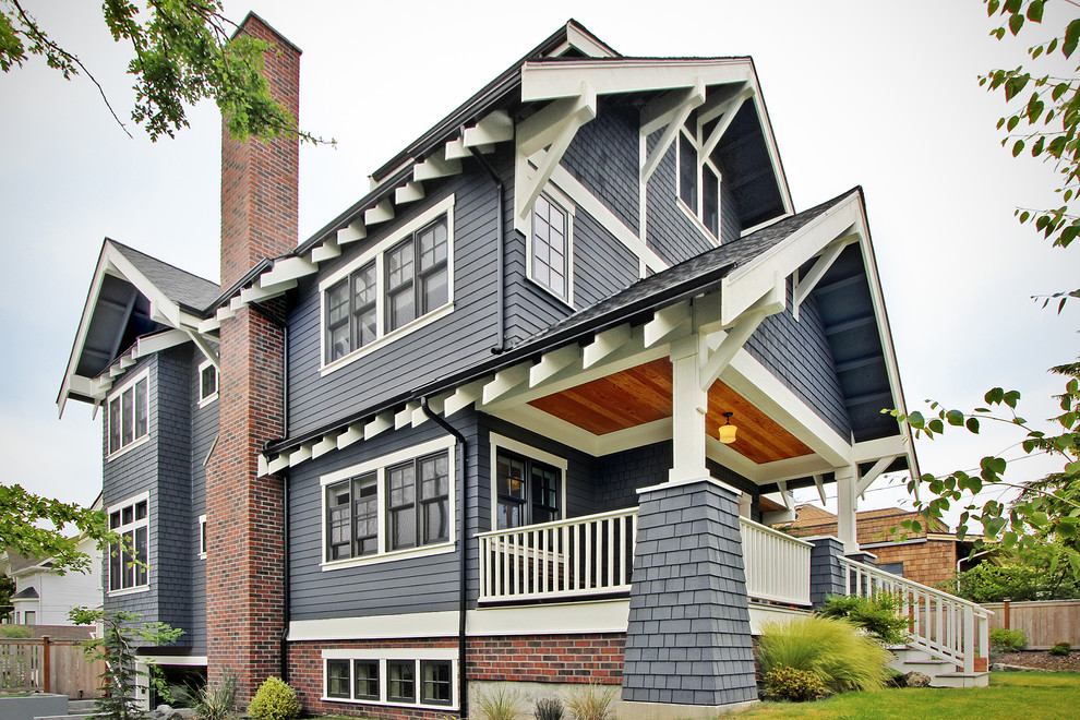 Mid-sized craftsman three-story wood exterior home idea in Seattle