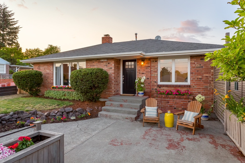 Inspiration for a 1950s one-story brick exterior home remodel in Seattle