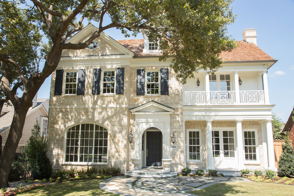 Large elegant beige three-story stone exterior home photo in Dallas with a shingle roof
