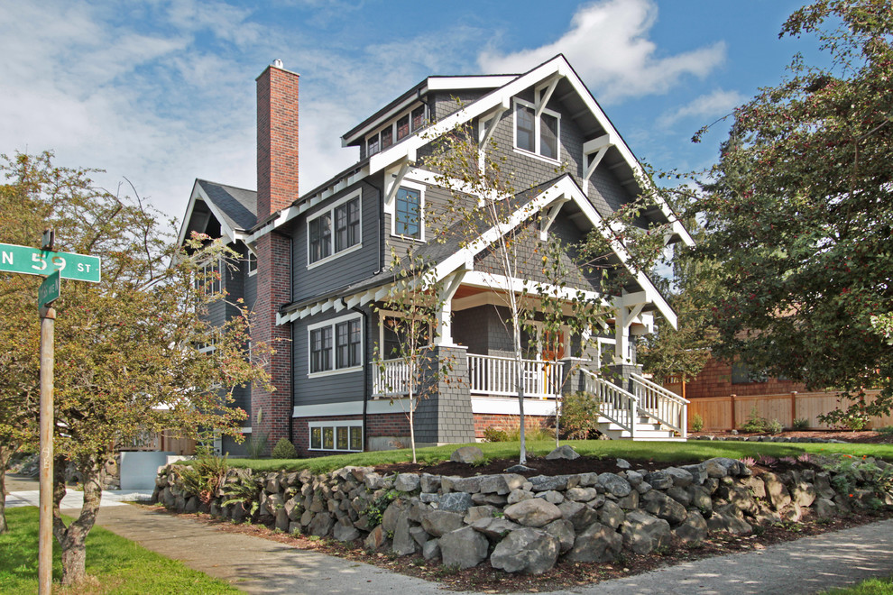 Photo of a medium sized and gey classic detached house in Seattle with three floors, wood cladding, a pitched roof and a shingle roof.