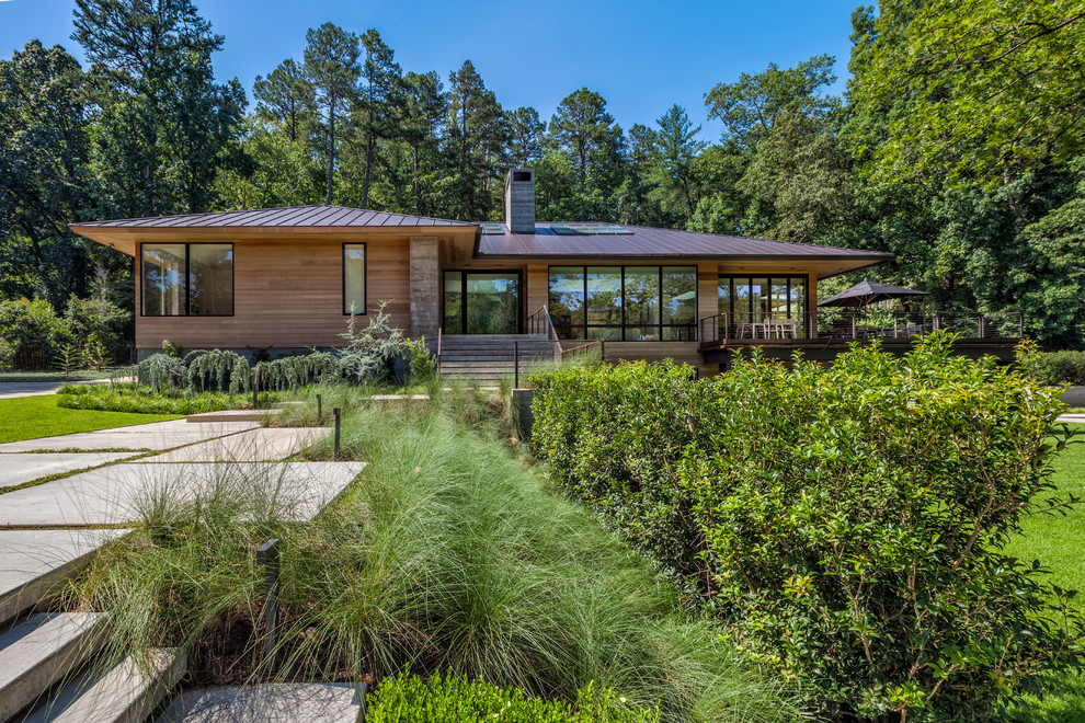 Inspiration for a large contemporary multicolored two-story mixed siding exterior home remodel in Charleston with a hip roof