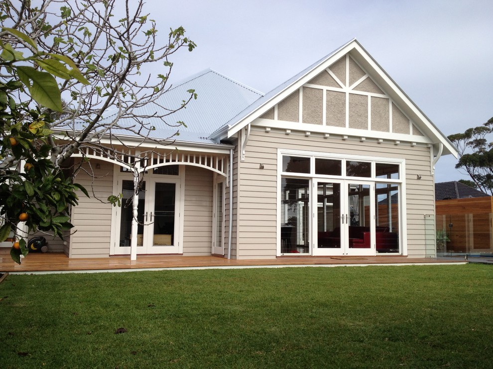 Inspiration for a classic house exterior in Melbourne with wood cladding.