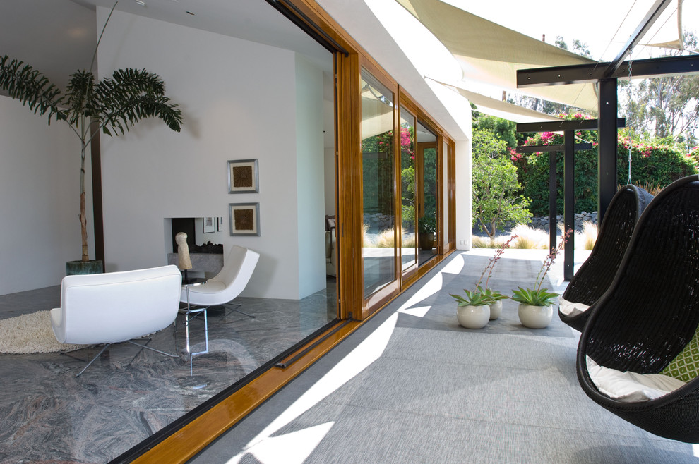 Example of a trendy glass exterior home design in San Diego