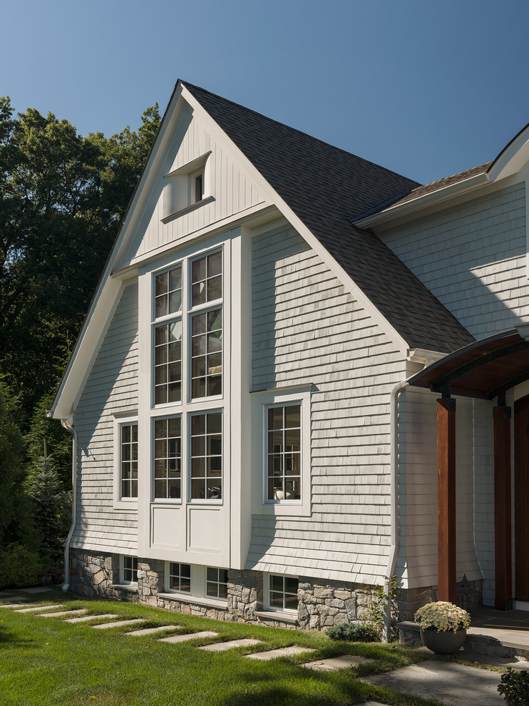 Large transitional gray two-story wood exterior home photo in New York with a shingle roof