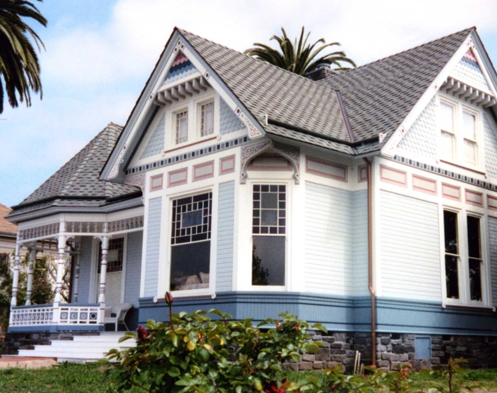 Inspiration for a medium sized and blue victorian two floor house exterior in San Luis Obispo with vinyl cladding.