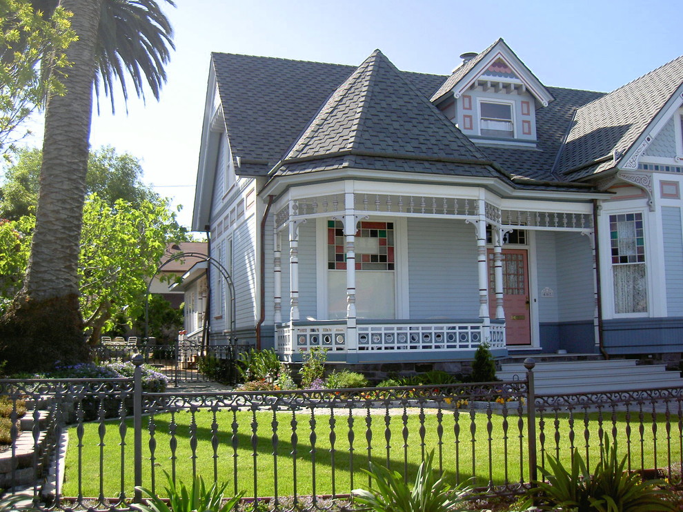 Example of a mid-sized ornate blue two-story vinyl exterior home design in San Luis Obispo