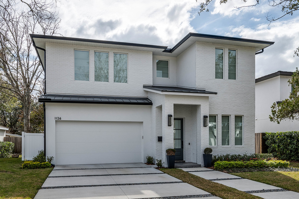 Inspiration for a large transitional white two-story house exterior remodel in Orlando