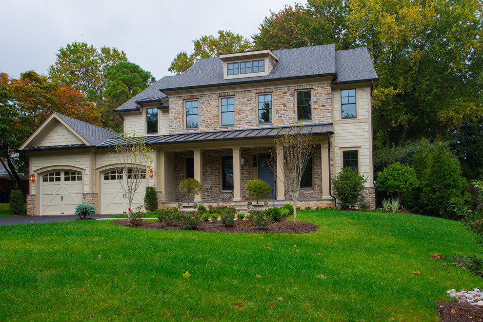 Medium sized and beige classic two floor house exterior in DC Metro with stone cladding.