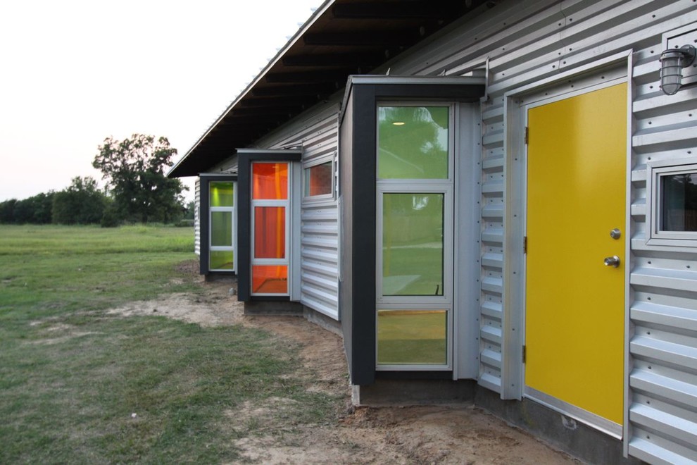 Inspiration pour une façade de maison container métallique minimaliste.