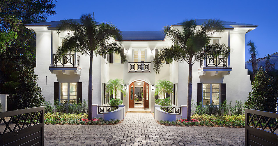 Large transitional white two-story stucco exterior home idea in Miami