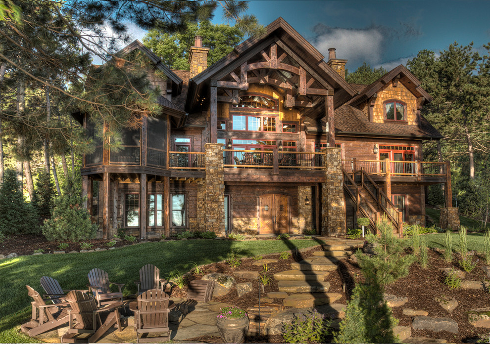 Inspiration for a large timeless multicolored three-story wood exterior home remodel in Minneapolis with a shingle roof