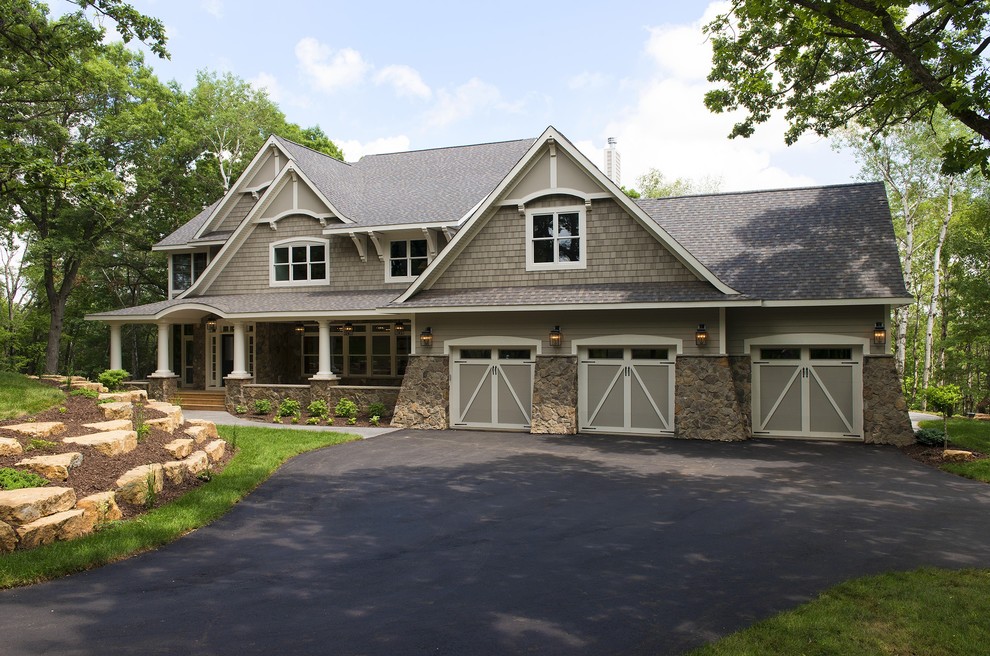 Inspiration for a large timeless gray two-story wood gable roof remodel in Minneapolis