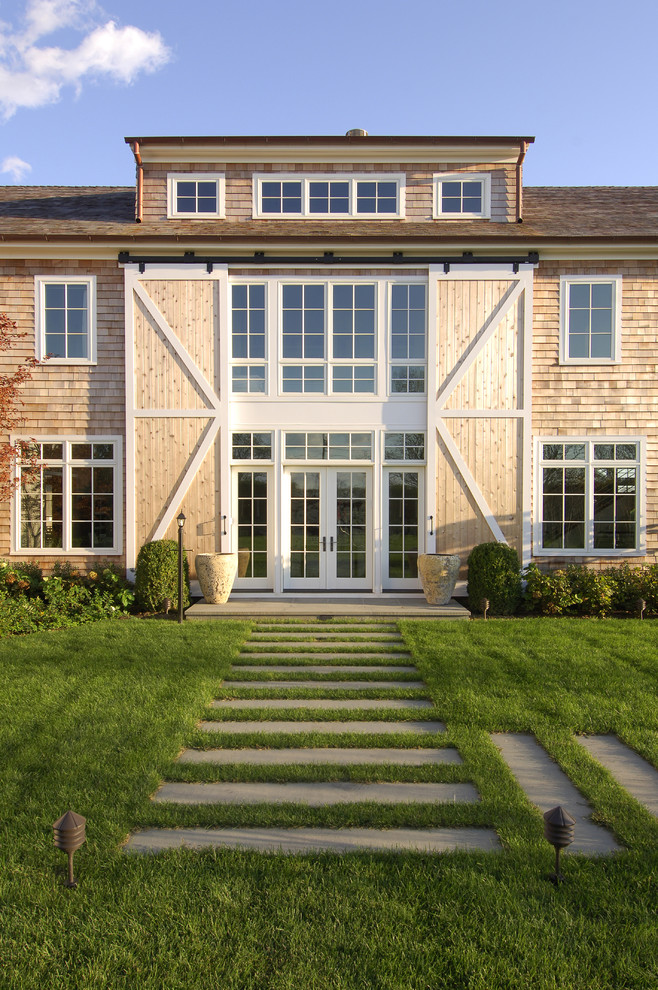 Elegant two-story wood exterior home photo in New York