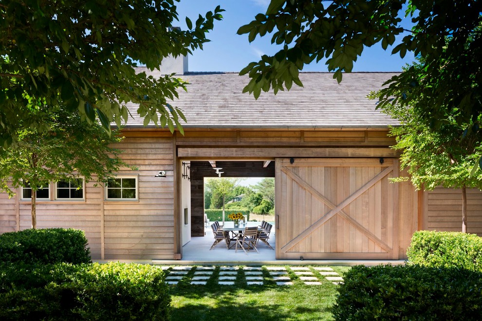 This is an example of a rustic house exterior in New York with wood cladding.