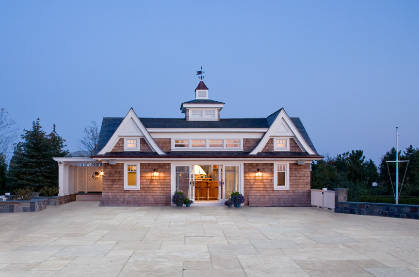 Example of a beach style brown one-story wood exterior home design in New York