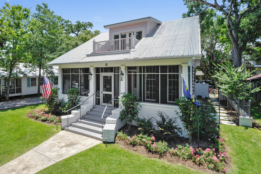 Design ideas for a classic two floor house exterior in New Orleans with mixed cladding.
