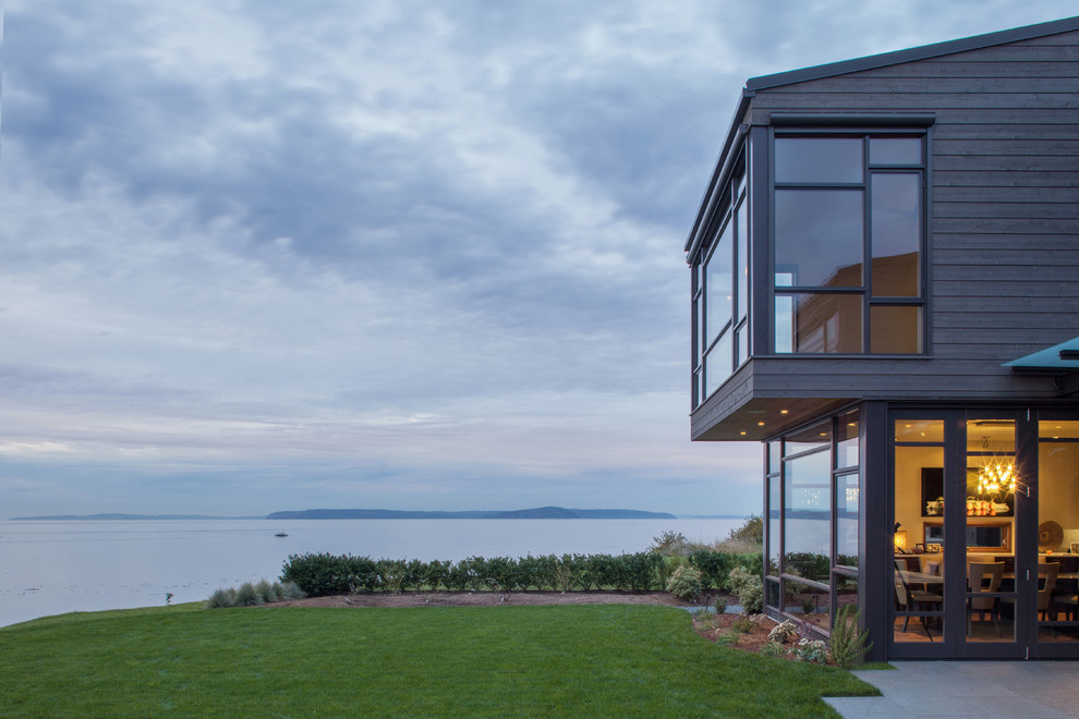 Inspiration for a medium sized and gey contemporary two floor house exterior in Seattle with wood cladding.