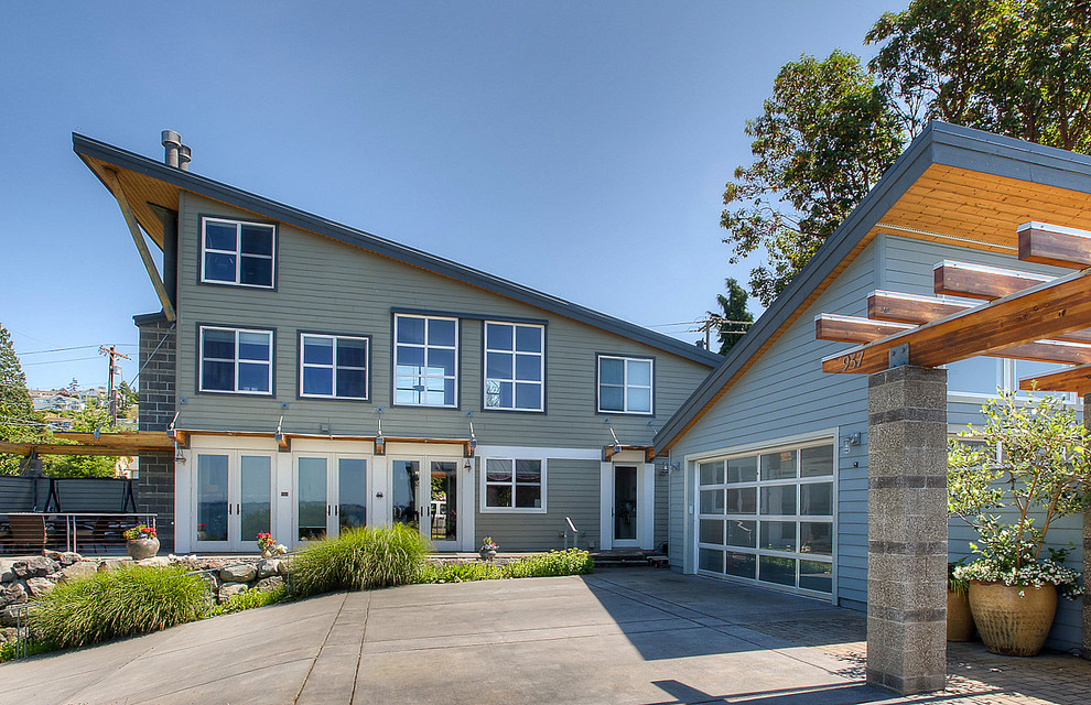 Example of a beach style blue exterior home design in Seattle