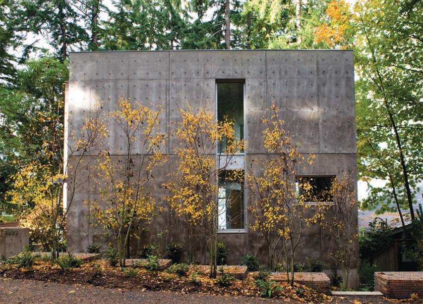 Photo of a medium sized and gey contemporary concrete detached house in Seattle with three floors and a flat roof.