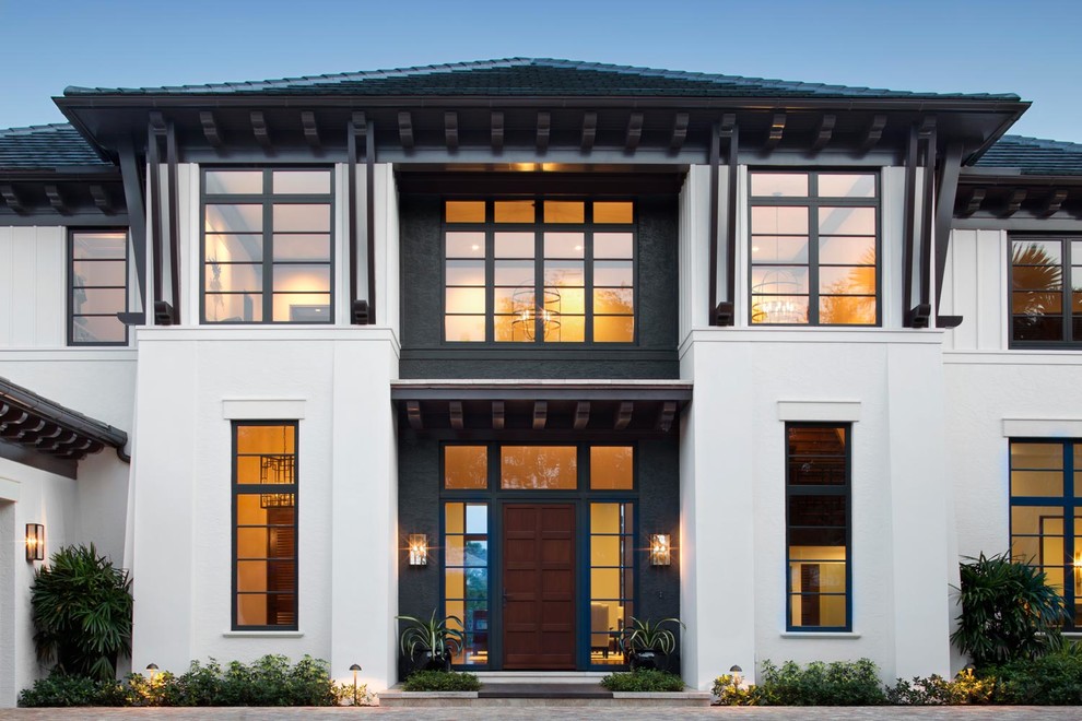 Transitional white two-story exterior home photo in Miami
