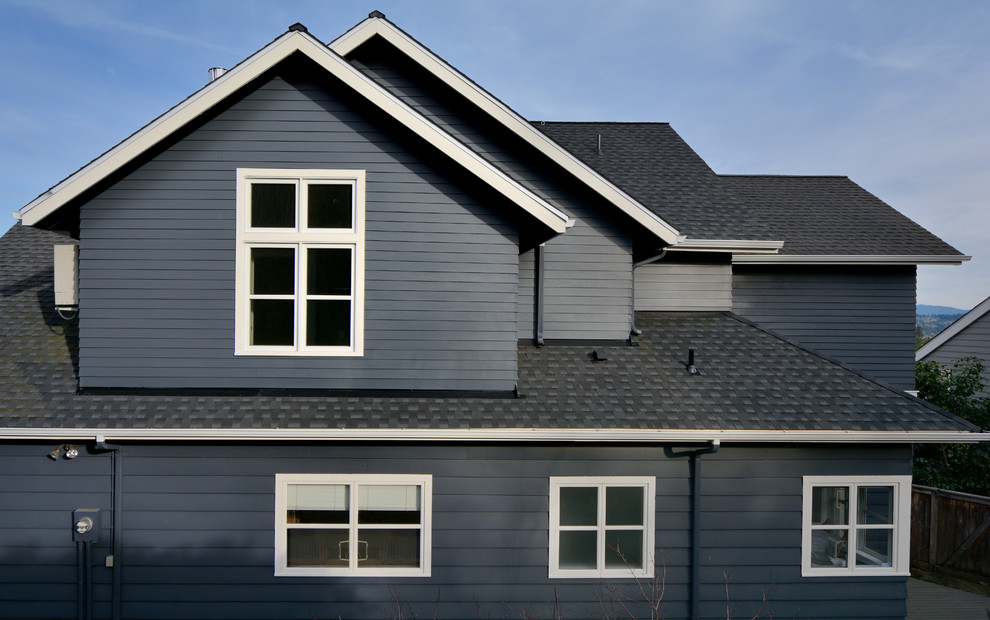 Mid-sized transitional gray two-story wood gable roof photo in Seattle