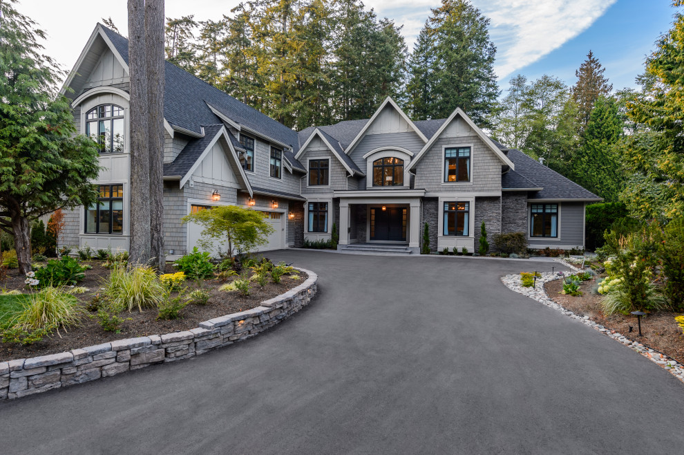 Huge transitional gray two-story mixed siding exterior home photo in Vancouver with a shingle roof