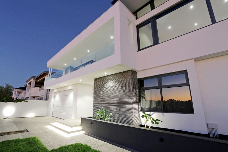Photo of an expansive and white modern two floor brick detached house in Perth with a flat roof and a mixed material roof.
